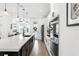 Bright, modern kitchen with a large island, pendant lights, stainless steel appliances, and an open design at 8460 Sperry St, Orlando, FL 32827