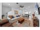Inviting living room open to dining and kitchen, featuring modern decor, stylish furnishings, and plenty of natural light at 8460 Sperry St, Orlando, FL 32827