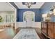 Elegant foyer with navy walls, white trim, hardwood floors, and stylish entry furnishings at 8812 S Bay Dr, Orlando, FL 32819