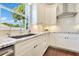 Well-lit kitchen featuring granite counters, stainless steel appliances, and a nice window with a view of trees at 8812 S Bay Dr, Orlando, FL 32819