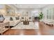 Bright living room featuring hardwood floors, neutral tones, and an inviting seating arrangement at 8812 S Bay Dr, Orlando, FL 32819