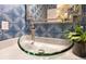 Stylish powder room featuring a glass vessel sink and brushed nickel faucet for a modern aesthetic at 8812 S Bay Dr, Orlando, FL 32819