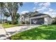 Well-manicured lawn and large driveway leading to a two-car garage enhances this charming home at 1013 Silcox Branch Cir, Oviedo, FL 32765
