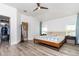 Main bedroom with hardwood floors, ceiling fan, walk-in closet, and access to a private bathroom at 1013 Silcox Branch Cir, Oviedo, FL 32765