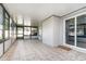 Enclosed patio featuring tiled floors and sliding glass doors to the backyard at 1013 Silcox Branch Cir, Oviedo, FL 32765