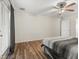 Spacious bedroom with modern wood floors and ceiling fan at 10247 Mason Loop, Clermont, FL 34711
