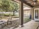 Covered patio perfect for outdoor relaxation, with a ceiling fan and view of the backyard at 10247 Mason Loop, Clermont, FL 34711