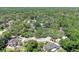 Aerial view showcasing the lush, tree-lined neighborhood with well-maintained homes and curving streets at 107 Wayland Cir, Longwood, FL 32779