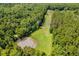 Aerial community view including a ball field and basketball court surrounded by trees at 107 Wayland Cir, Longwood, FL 32779