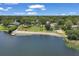 Aerial view of community beach with playground, volleyball court, and picnic area by the lake at 107 Wayland Cir, Longwood, FL 32779