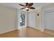 Cozy bedroom showcasing a ceiling fan, closet, and window for natural light at 107 Wayland Cir, Longwood, FL 32779