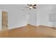 Neutral bedroom features wood floors, a walk-in closet, and ensuite bathroom at 107 Wayland Cir, Longwood, FL 32779