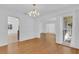 Dining room with chandelier and large window bringing in natural light at 107 Wayland Cir, Longwood, FL 32779