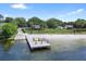 Community beachfront dock provides easy lake access, ideal spot for fishing, boating, enjoying scenic waterfront views at 107 Wayland Cir, Longwood, FL 32779
