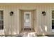 Welcoming front door with decorative glass and sconces, complemented by a 'Welcome' mat at 107 Wayland Cir, Longwood, FL 32779