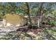 Charming single-story home with a manicured front lawn and mature trees at 107 Wayland Cir, Longwood, FL 32779