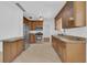 Spacious kitchen featuring stainless steel appliances, granite countertops, and ample cabinetry at 107 Wayland Cir, Longwood, FL 32779