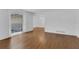 Bright living room showcasing a large window and hard surface floors at 107 Wayland Cir, Longwood, FL 32779