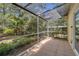 Enjoy this covered patio area, surrounded by lush landscaping, perfect for peaceful relaxation and outdoor living at 107 Wayland Cir, Longwood, FL 32779