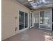 Covered patio area featuring sliding glass doors, seamless indoor/outdoor transition, enhancing natural light and backyard views at 107 Wayland Cir, Longwood, FL 32779