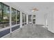 Sun-filled room featuring large windows offering outdoor views and tile flooring at 107 Wayland Cir, Longwood, FL 32779