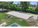 Aerial view of the community volleyball court with picnic tables, enhances recreational opportunities, promotes active lifestyle at 107 Wayland Cir, Longwood, FL 32779