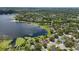Aerial view of the community showing many houses located on a large lake at 1113 Hawthorne Cove Dr, Ocoee, FL 34761