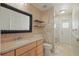 Bathroom featuring neutral toned walls, a wooden vanity, and glass enclosed shower at 1113 Hawthorne Cove Dr, Ocoee, FL 34761