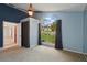 Bedroom featuring a large arched window with a view of the front yard and a ceiling fan at 1113 Hawthorne Cove Dr, Ocoee, FL 34761