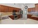 Spacious kitchen with stainless steel appliances, tile floors, and ample cabinetry offering plenty of storage at 1113 Hawthorne Cove Dr, Ocoee, FL 34761