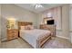 Inviting bedroom features a wood bed frame, dresser, nightstand, and a cozy rug on tile flooring at 112 Cordova Ave, Davenport, FL 33897