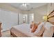 Comfortable bedroom with a large closet, neutral walls, and a glimpse into the adjoining bathroom at 112 Cordova Ave, Davenport, FL 33897