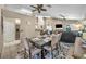Dining area with seating for six, seamlessly connecting to the kitchen and living spaces at 112 Cordova Ave, Davenport, FL 33897