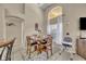 Dining area showcasing natural light from large windows and space for a table with seating at 112 Cordova Ave, Davenport, FL 33897