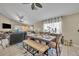 Open dining area with modern table set and beautiful decor adjacent to the living area, bathed in natural light at 112 Cordova Ave, Davenport, FL 33897