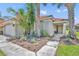 Inviting front entrance featuring a tiled roof, lush landscaping, and a cozy seating area, perfect for enjoying the outdoors at 112 Cordova Ave, Davenport, FL 33897