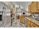 Bright kitchen featuring stainless steel appliances, granite countertops, and tile flooring at 112 Cordova Ave, Davenport, FL 33897