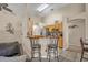 Open kitchen design with sleek stainless steel appliances and bar stool seating area at 112 Cordova Ave, Davenport, FL 33897