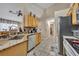 Well-equipped kitchen featuring granite countertops, stainless steel appliances, and ample cabinet space at 112 Cordova Ave, Davenport, FL 33897