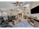 Spacious living room showcasing an open layout with kitchen and dining area at 112 Cordova Ave, Davenport, FL 33897
