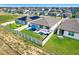 Aerial view of a backyard with patio sets and fenced yard in a residential neighborhood, showcasing the surrounding community at 1127 Foreshore Ln, Haines City, FL 33844