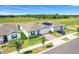 An aerial view of the property featuring green spaces and the surrounding neighborhood at 1127 Foreshore Ln, Haines City, FL 33844