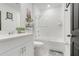 Bright bathroom with a modern vanity, stylish decor, and a sleek shower and tub combo at 1127 Foreshore Ln, Haines City, FL 33844