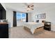Bright bedroom featuring a ceiling fan, neutral walls, and ample natural light from a large window at 1127 Foreshore Ln, Haines City, FL 33844