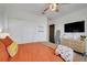 Comfortable bedroom with natural light, ample closet space, TV, and stylish furnishings at 1127 Foreshore Ln, Haines City, FL 33844