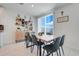 Cozy dining area with a stylish table, seating for six, and a built-in bar area with open shelving at 1127 Foreshore Ln, Haines City, FL 33844