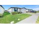 Lovely single Gathering home with manicured lawn, brick driveway, and attached garage at 1127 Foreshore Ln, Haines City, FL 33844