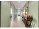 Inviting hallway with elegant lighting and a stylish console table with decor at 1127 Foreshore Ln, Haines City, FL 33844
