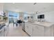 Well-lit kitchen with an island, stainless steel appliances, and an adjacent dining area with sliding glass doors at 1127 Foreshore Ln, Haines City, FL 33844