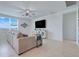 Bright living room featuring neutral tones, tiled floors, and large windows at 1127 Foreshore Ln, Haines City, FL 33844